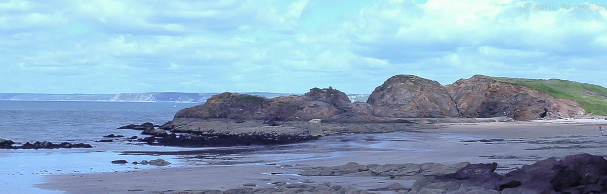 sea, sand and rough rocks